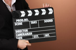 Movie production clapper board on color background