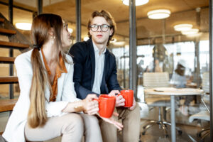 Man and woman having serious discussion at work