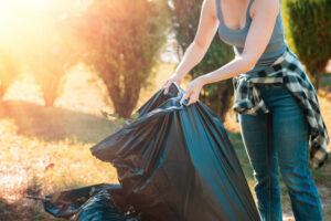 Woman holding trash bag