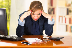 Frustrated woman reviewing her finances