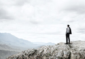 Businessman at the top of mountain