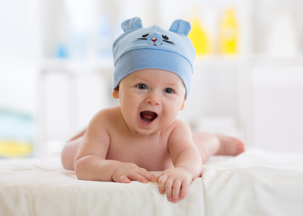 Cute baby boy in blue hat