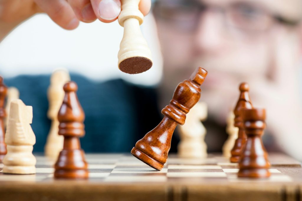 Playing chess with grandkids after Sunday dinner